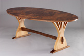 custom expanding dining table made from red oak and walnut burl