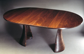 round tinsman dining table expands to oval to seat 8 or more