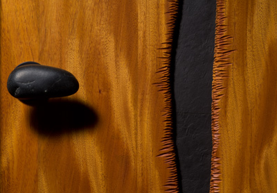 Slate and Mahogany door detail showing stone handle and carving by furniture maker Seth Rolland