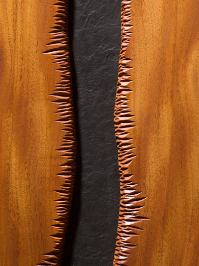 Slate and Mahogany door detail showing hand carved wood edge by Seth Rolland custom furniture