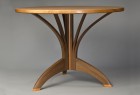 Round dining cafe table in walnut and cherry by Seth Rolland custom furniture design