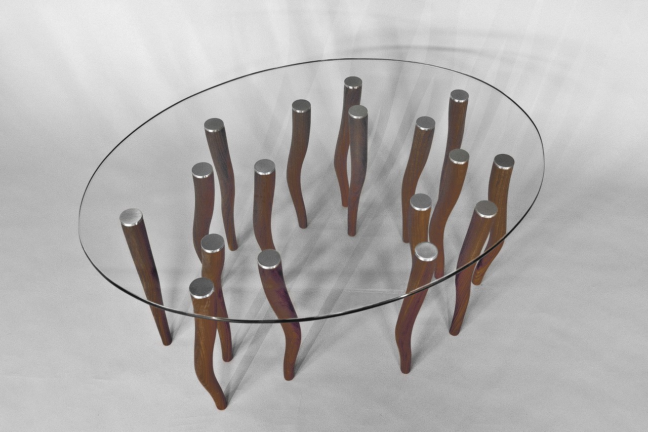 Top view of Drift coffee table, glass oval top and wood legs by Seth Rolland custom furniture design