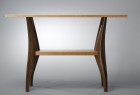 Low view of Gazelle hall table hand carved from walnut and cherry by Seth Rolland custom furniture design