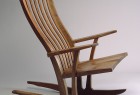 comfortable walnut wood rocking chair with flexible back slats hand carved and fitted by Seth Rolland custom furniture