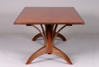wood dining table crafted from solid walnut and bubinga veneer by Seth Rolland custom furniture design