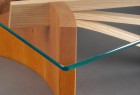 detail of square glass top coffee table with cherry adn expanded ash wood steam bent by Seth Rolland custom furniture design