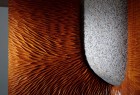 Carved mahogany and stone Tsubo coffee table detail hand carved by Seth Rolland custom furniture design