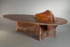 One of a kind wood and stone coffee table with hand carved base.