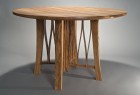 Contemporary solid wood round dining table by Seth Rolland fine furniture